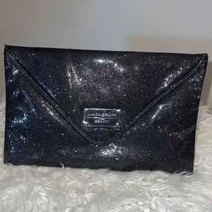Laura Geller beauty black sparkle clutch